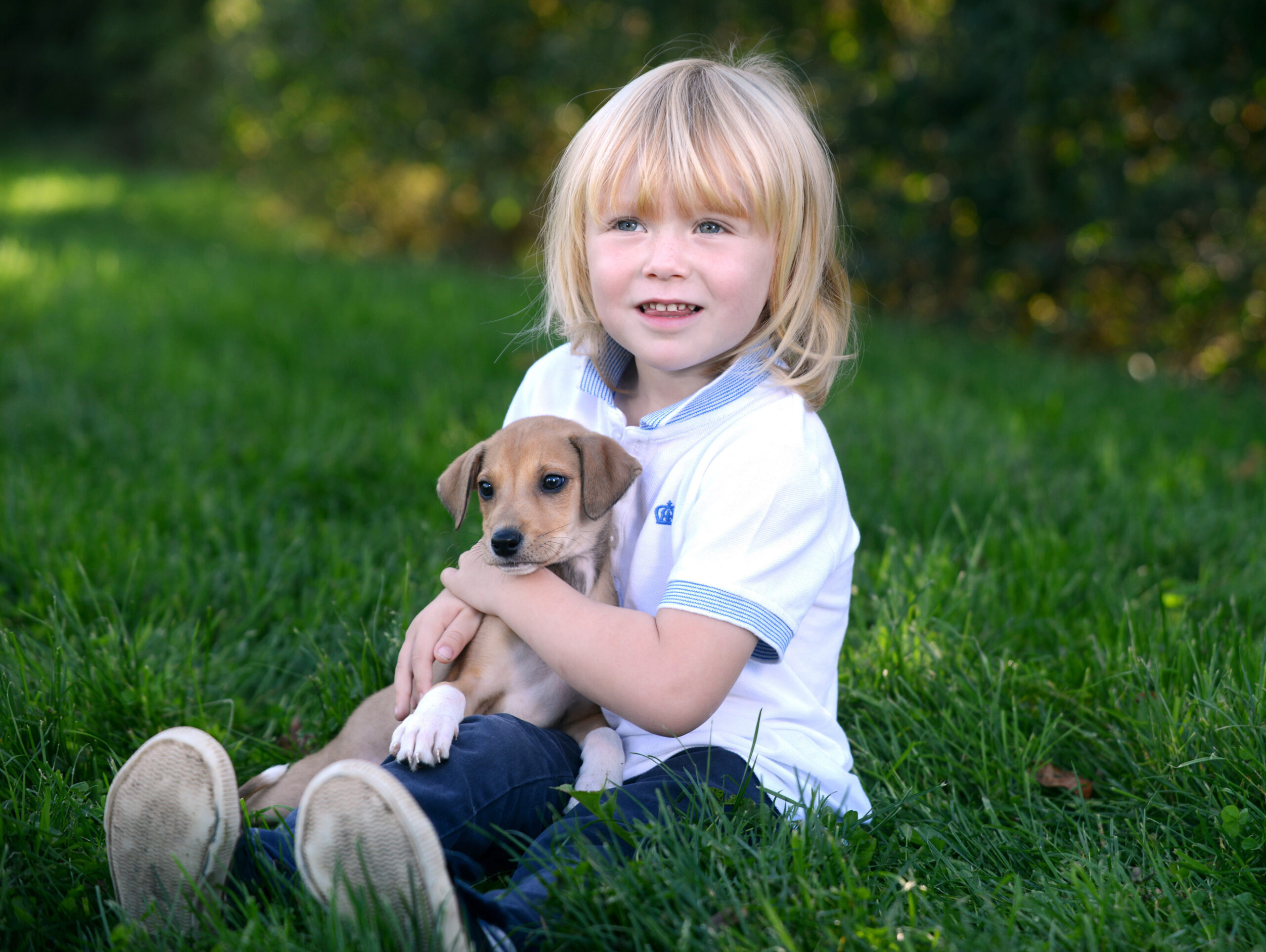 girl holding puppy